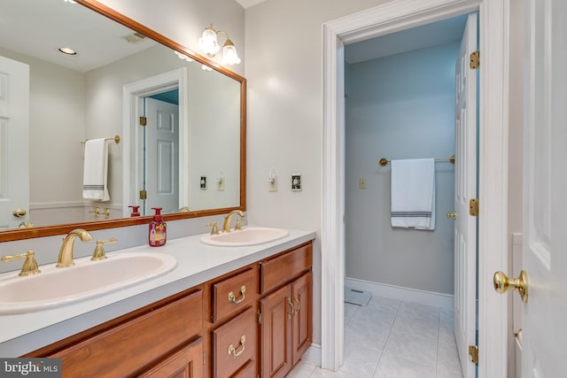 bathroom featuring tile patterned floors and vanity