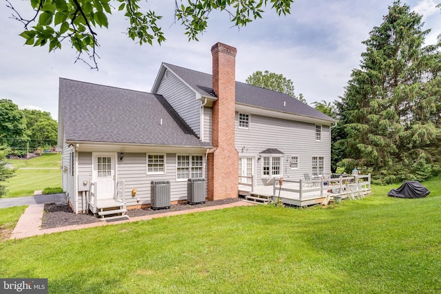 back of house with a yard, central AC unit, and a deck