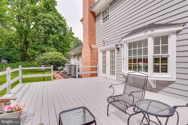 deck featuring french doors and central air condition unit