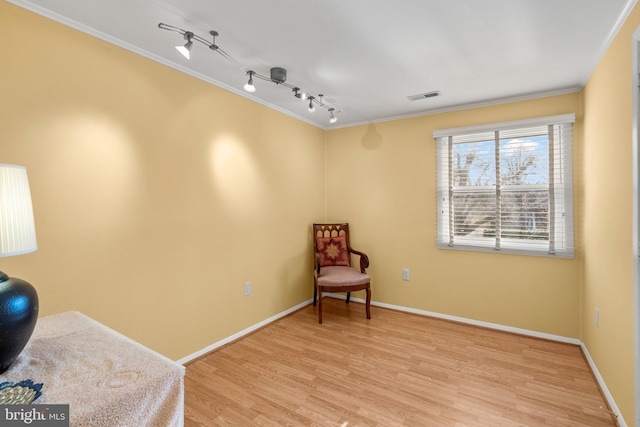 1022 Tyler Ave, Annapolis, MD 21403 - sitting room with crown molding, wood finished floors, and track lighting
