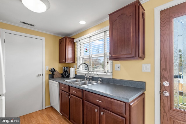 1022 Tyler Ave, Annapolis, MD 21403 - kitchen featuring white dishwasher, light wood-type flooring, dark countertops, and ornamental molding
