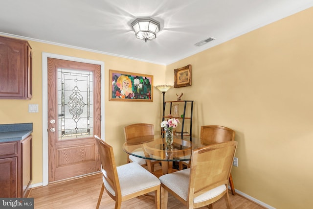 1022 Tyler Ave, Annapolis, MD 21403 - dining space with light wood-style flooring and ornamental molding