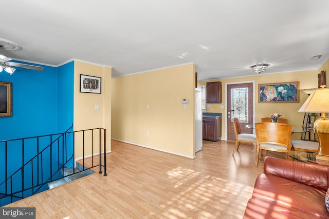 1022 Tyler Ave, Annapolis, MD 21403 - living room featuring crown molding, light wood-style floors, and ceiling fan