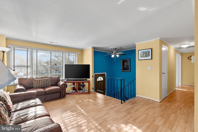 1022 Tyler Ave, Annapolis, MD 21403 - living area featuring ornamental molding, wood finished floors, and a ceiling fan