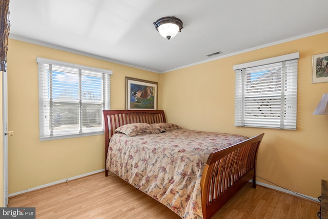 1022 Tyler Ave, Annapolis, MD 21403 - bedroom with wood finished floors and ornamental molding