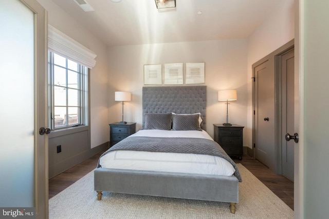 bedroom with hardwood / wood-style floors