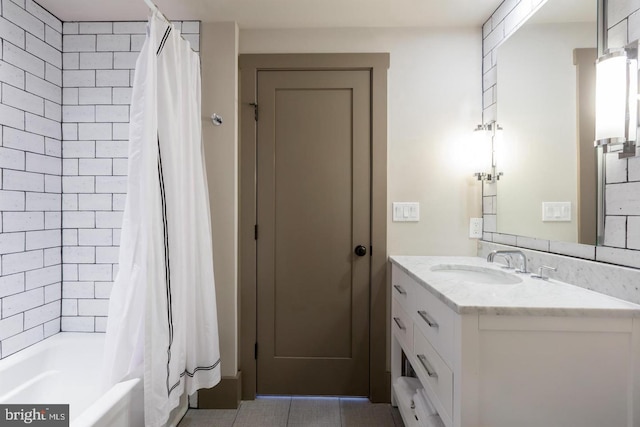 bathroom with tile patterned flooring, vanity, and shower / tub combo with curtain