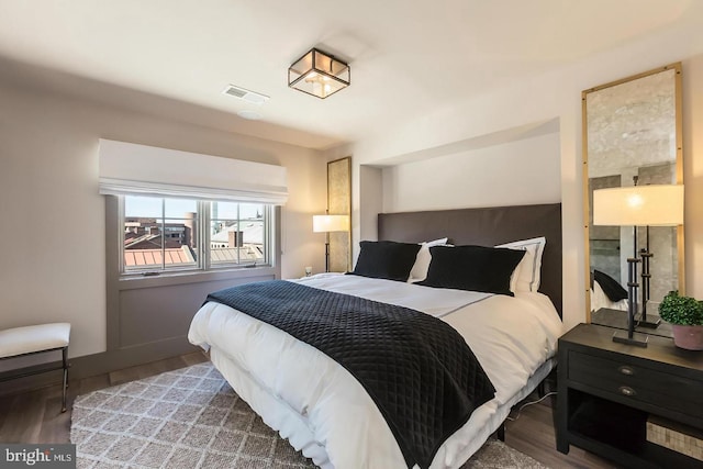 bedroom with wood-type flooring