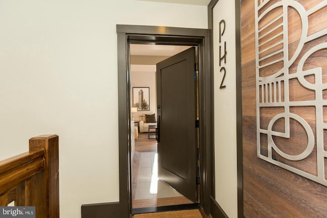 hall featuring tile patterned flooring