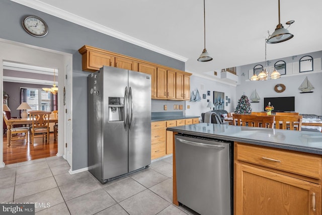 kitchen with hanging light fixtures, crown molding, appliances with stainless steel finishes, light tile patterned flooring, and a chandelier