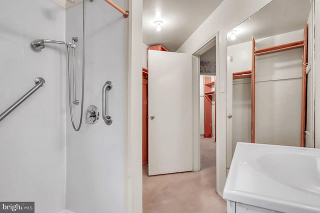 bathroom with vanity and walk in shower