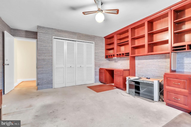 carpeted office with ceiling fan