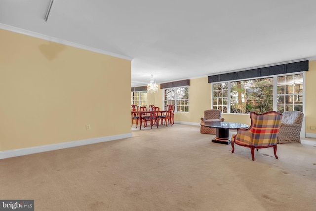 sitting room featuring a notable chandelier, light colored carpet, and crown molding