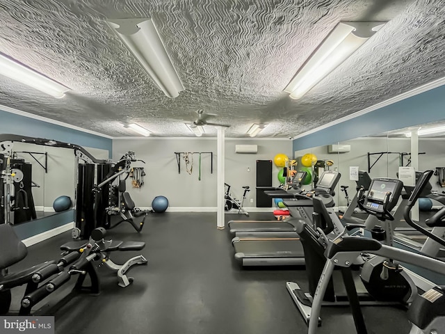 gym featuring an AC wall unit, a textured ceiling, and ornamental molding