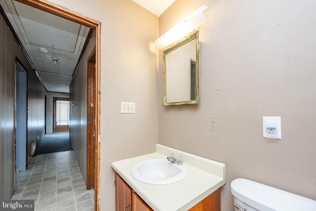 bathroom featuring vanity and toilet