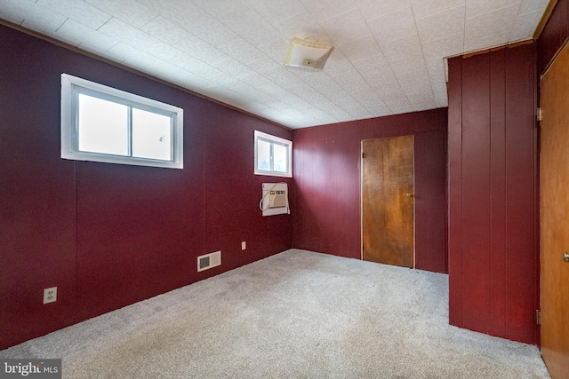 unfurnished room with light colored carpet