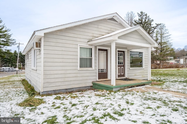 bungalow with an AC wall unit