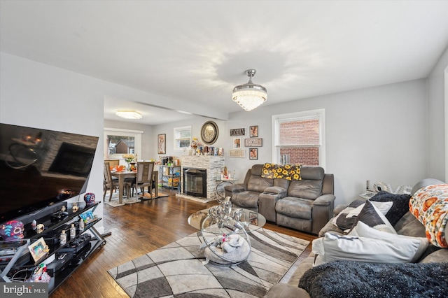 living room featuring dark hardwood / wood-style floors and a fireplace