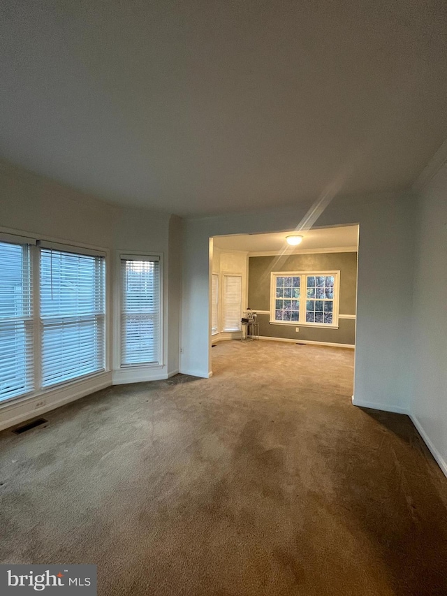 unfurnished living room with carpet flooring