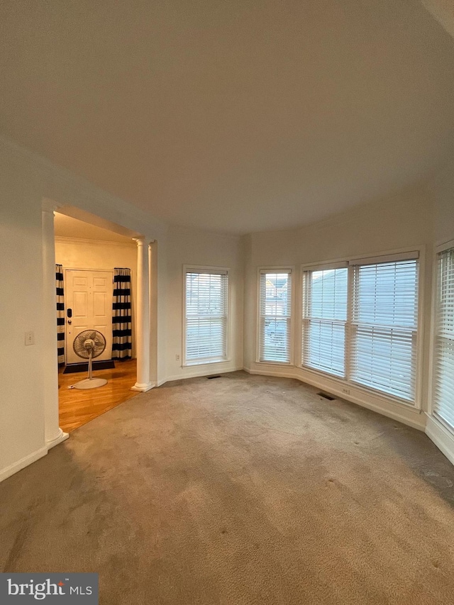 unfurnished living room featuring carpet floors