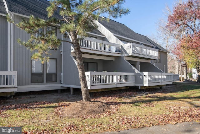 rear view of property with a balcony