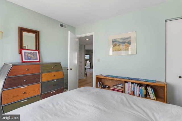 bedroom with wood-type flooring