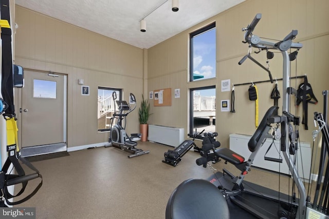 workout area with a textured ceiling