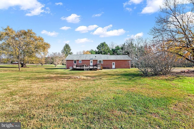 view of yard with a deck