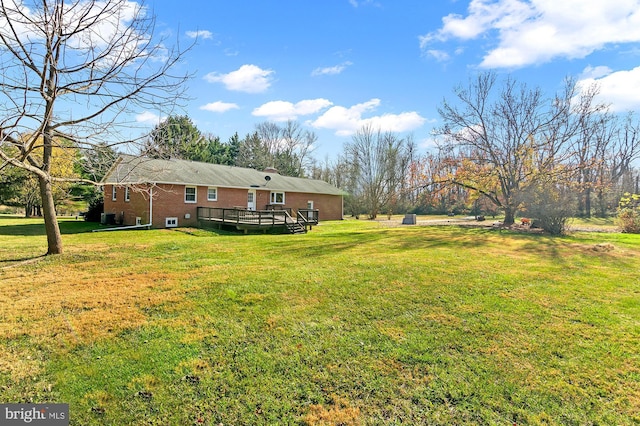 view of yard featuring a deck