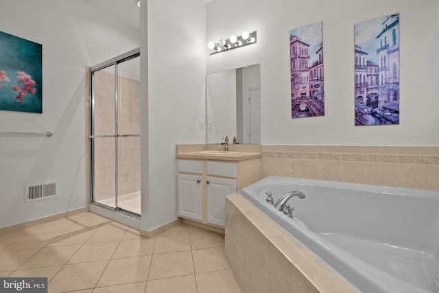 bathroom featuring tile patterned flooring, vanity, and shower with separate bathtub