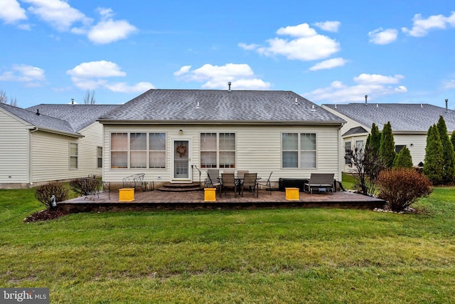 rear view of property with a yard and a patio