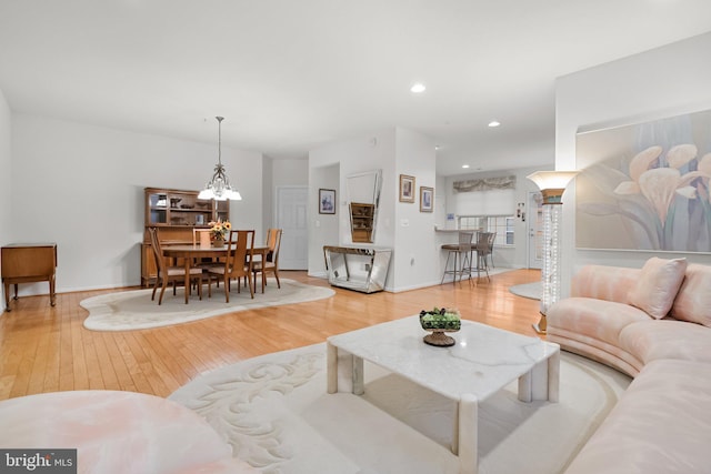 living room featuring a chandelier and hardwood / wood-style flooring