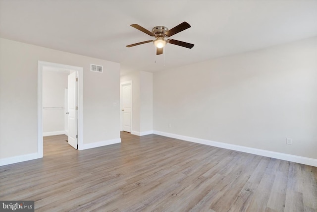 spare room featuring ceiling fan and light wood-type flooring