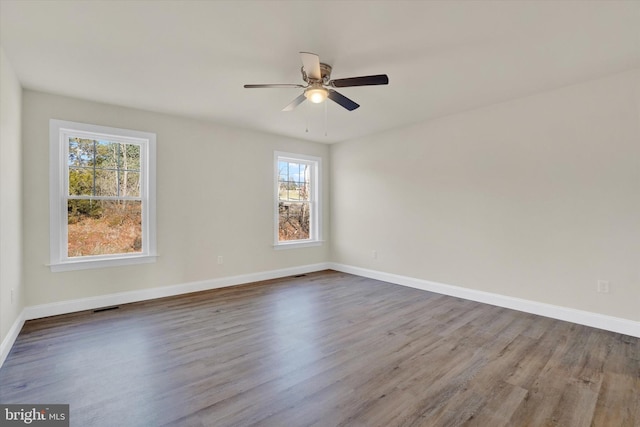 unfurnished room featuring hardwood / wood-style floors and ceiling fan