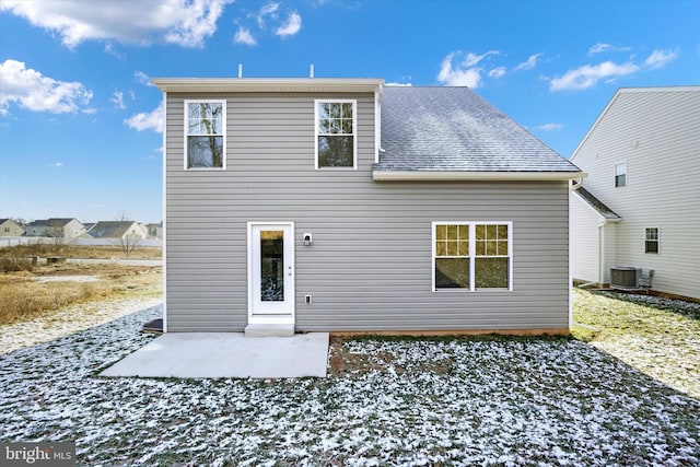 rear view of property with central AC and a patio