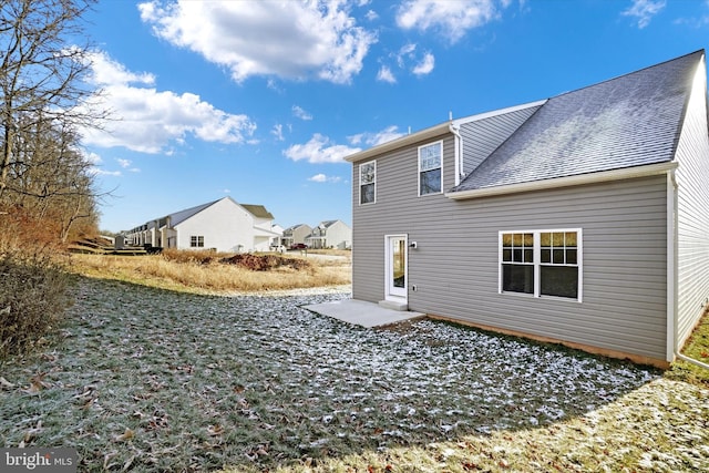 rear view of property featuring a patio area