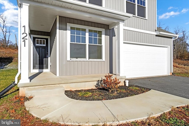 doorway to property featuring a garage