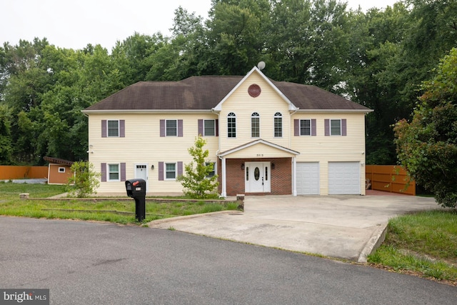 colonial inspired home featuring a garage