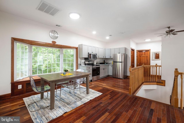 dining room featuring ceiling fan and dark hardwood / wood-style flooring