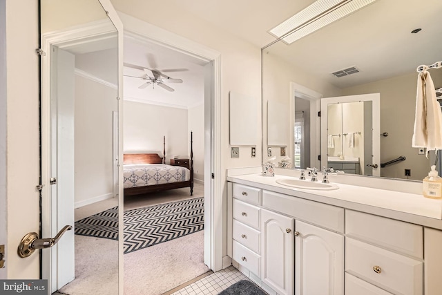 bathroom featuring tile patterned floors, ceiling fan, and vanity