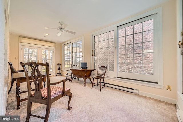 sunroom / solarium featuring ceiling fan