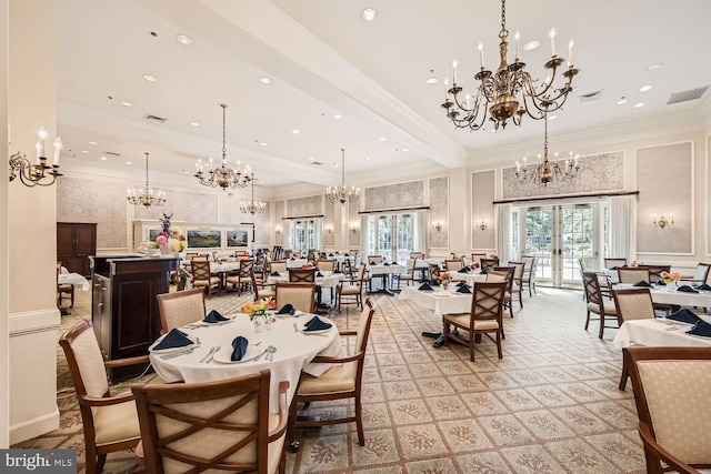 dining space featuring beam ceiling, ornamental molding, and french doors