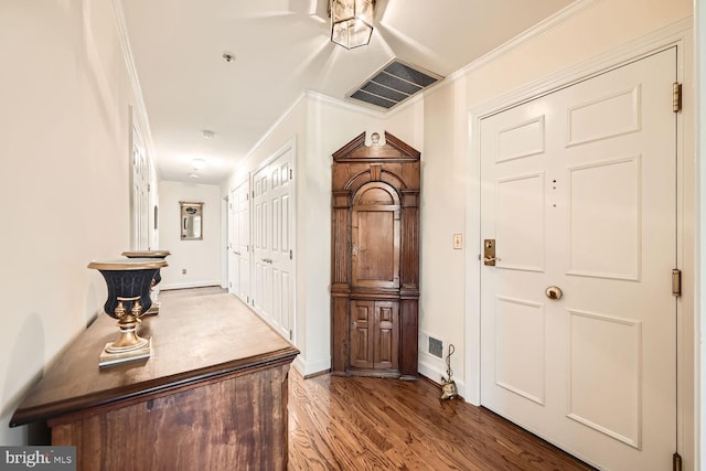 corridor featuring wood-type flooring and ornamental molding