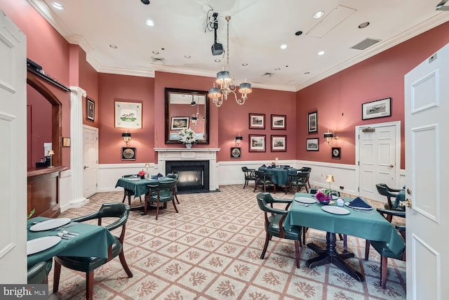 recreation room with an inviting chandelier and crown molding