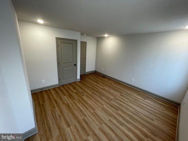 unfurnished room featuring light hardwood / wood-style floors