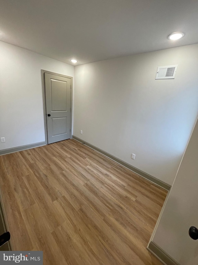 unfurnished room featuring light hardwood / wood-style flooring