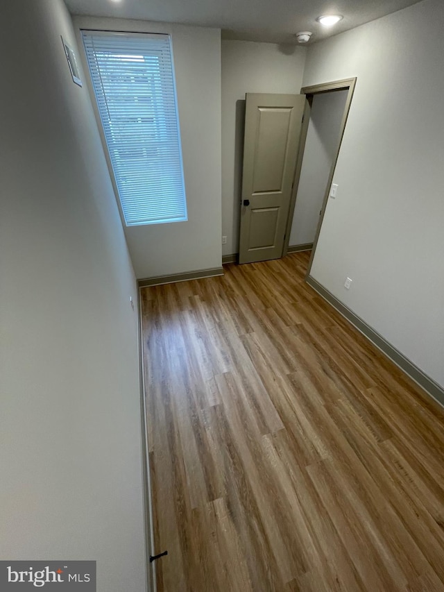 unfurnished room featuring light hardwood / wood-style floors