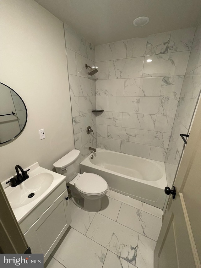 full bathroom with vanity, toilet, and tiled shower / bath