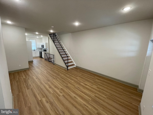 basement with light wood-type flooring