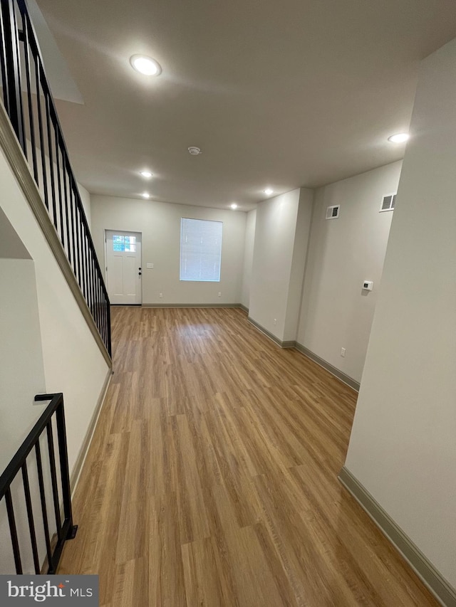 unfurnished living room featuring light hardwood / wood-style floors